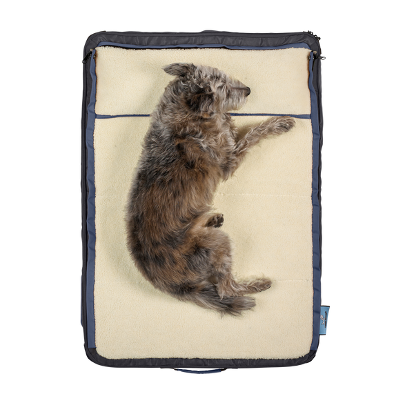 top view of small dog laying on Sherpa fleece, on medium gray dog bed, dog beds for large dogs, best dog beds for small dogs, dog sleeping in bed