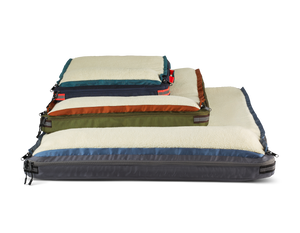 Stack of RuffRest pet beds from small to large in blue, green, and grey colors, dog sleep bed, dog bed for small dog, dog beds for large dogs, best dog beds
