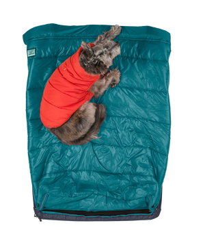 Bird's eye view of Kashi the Timberdog mascot laying on top of the sleeping bag feature, dog bed for small dog, dog beds for large dogs