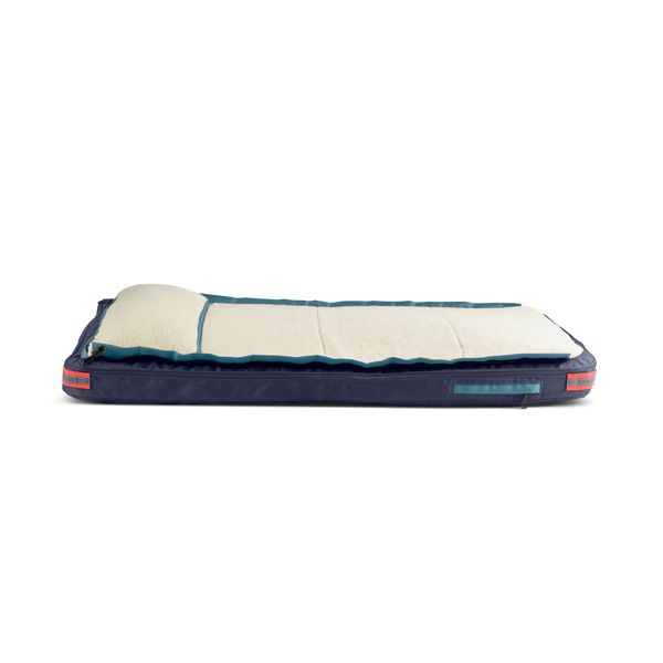 Side view of medium dog bed blue, with teal trim, orange accents, and cream colored fleece, dog beds for large dogs, best dog beds for small dogs