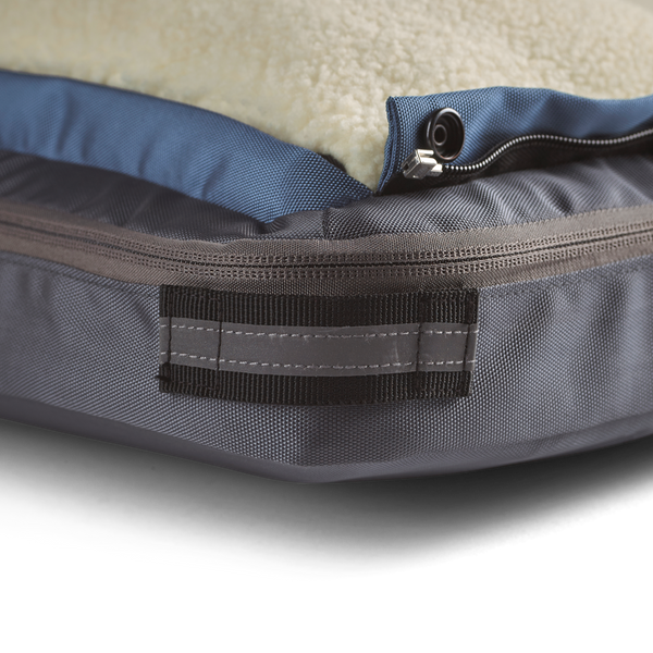 Close up showing detail of the black corner reflective accent and loop on small gray dog bed for travel, home, office, or on the road, dog beds for large dogs, best dog beds for small dogs