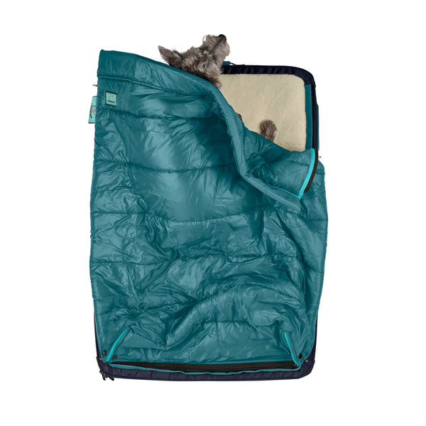 Kashi the dog sleeping comfortably in her teal or blue colored sleeping bag for dogs and pets, a patented feature of the RuffRest travel dog bed, dog beds for large dogs, best dog beds for small dogs, dog sleeping in bed